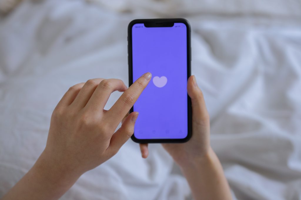 What Age Group is OkCupid For – Image of heart on cellphone