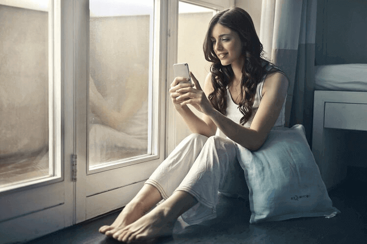 Who Uses Tinder The Most - woman on phone