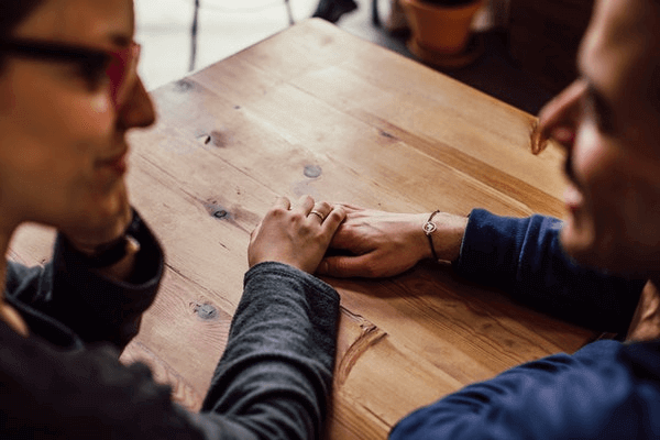 20 Conversation Topics For a First Date - holding hands on a date