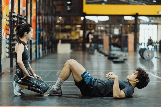 17 Fun Workouts for Couples - couple resistance training at the gym