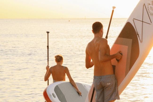 17 Fun Workouts for Couples - paddleboarding couple