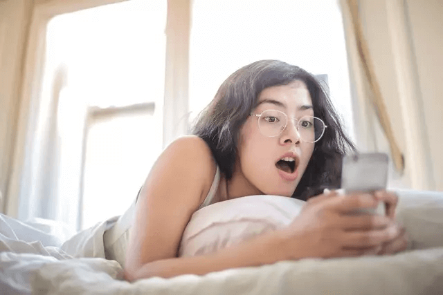 How Can You Check If Someone Is On Tinder - shocked girl on phone